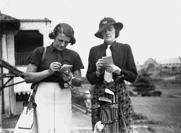 Miss H.Taylor and Mrs Fogarty attend to their cards, 26 November 1938  John Oxley Library, State Library of Queensland.